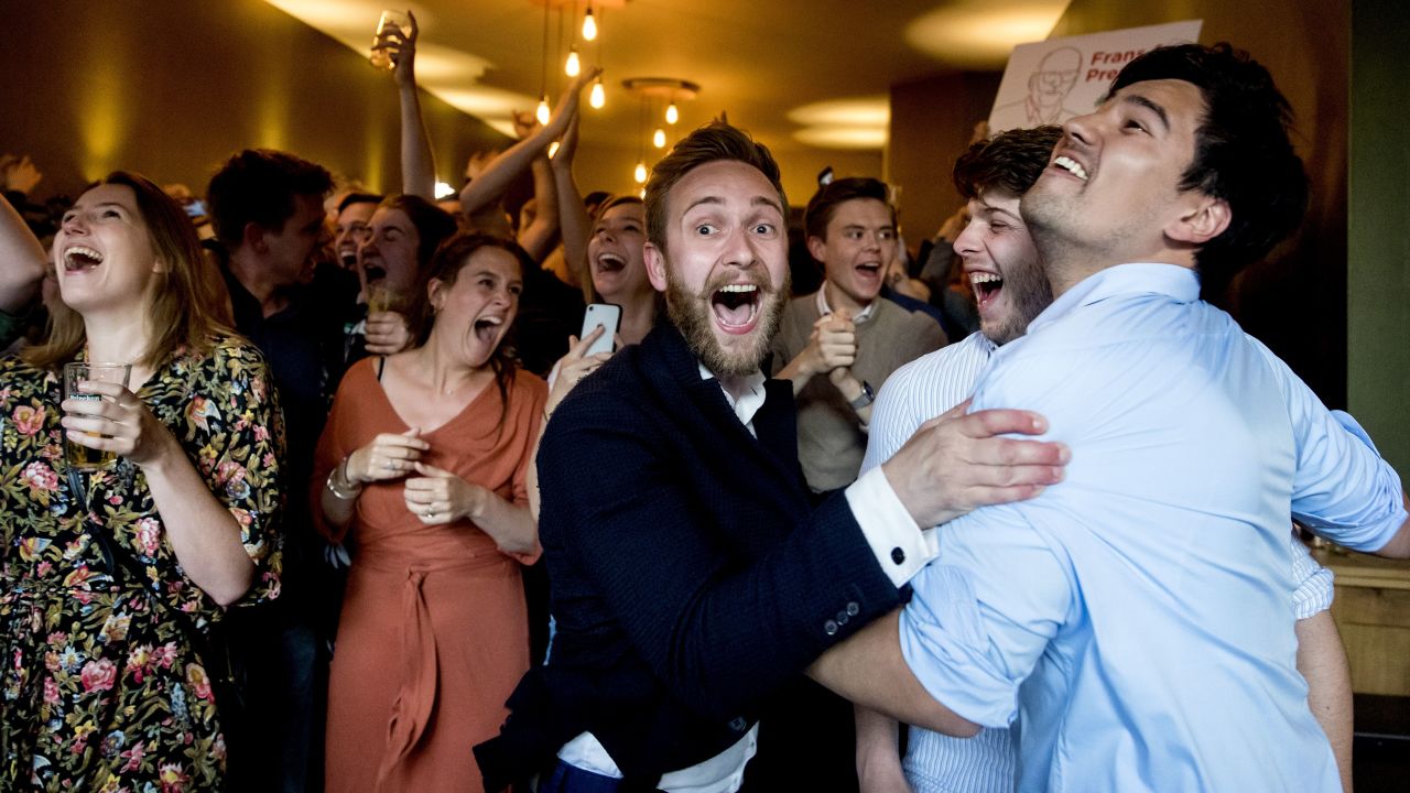 Members of the Labour Party (PvdA) celebrate after the exit polls were announced.