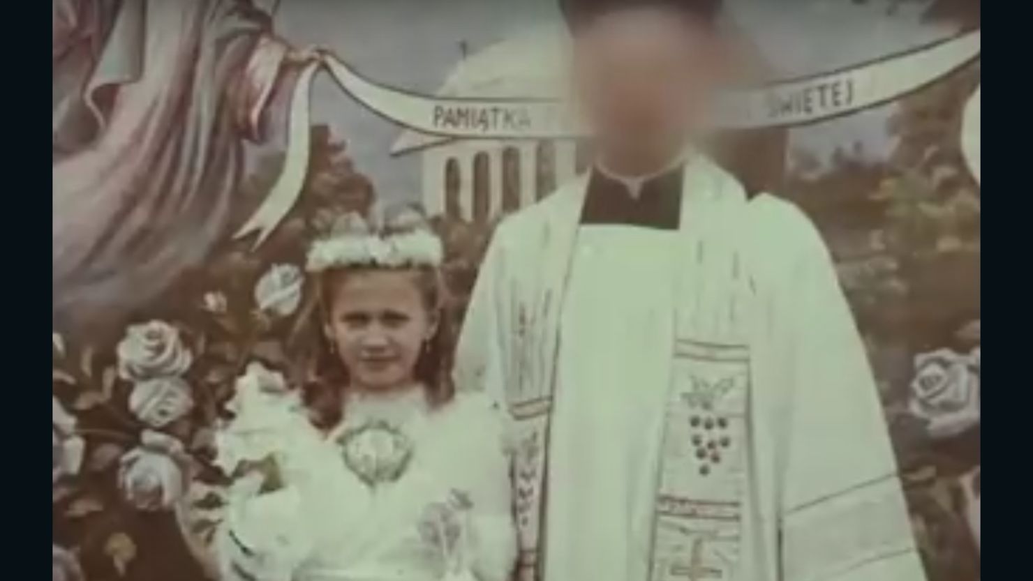 Anna Misiewicz with Father A, her alleged abuser during her first Holy Communion.