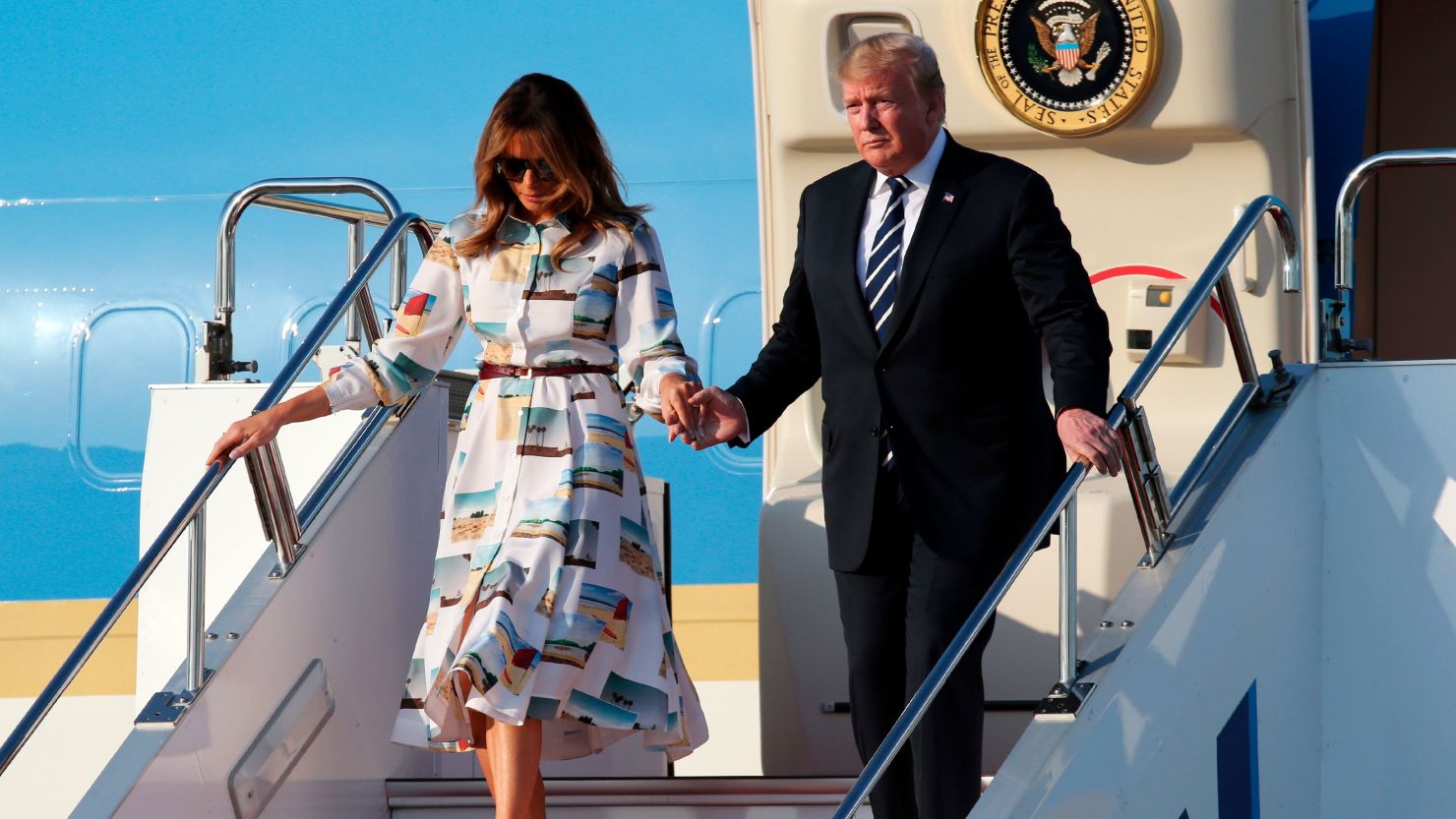 President Trump and First Lady Melania Trump disembark from Air Force One.