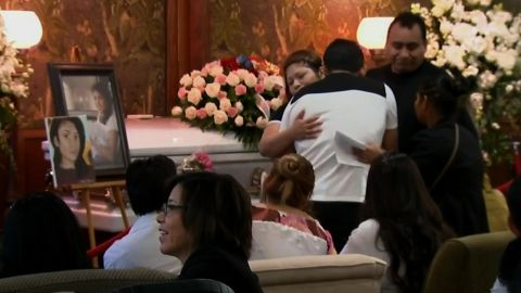 Mourners embrace on Saturday at Ochoa-Lopez's funeral in Chicago.