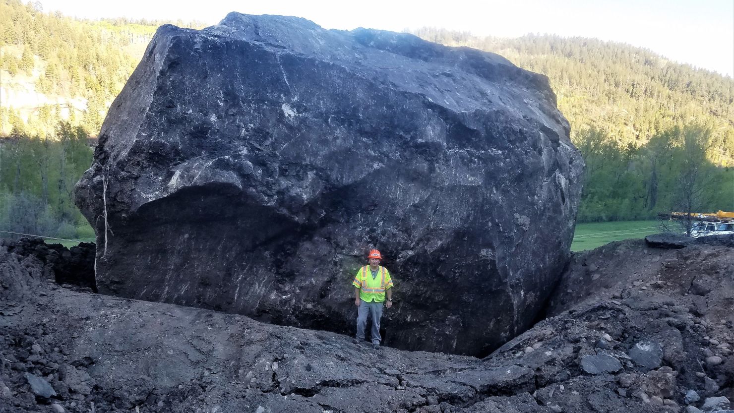 The Colorado Department of Transportation describes the boulder as the size of a building.