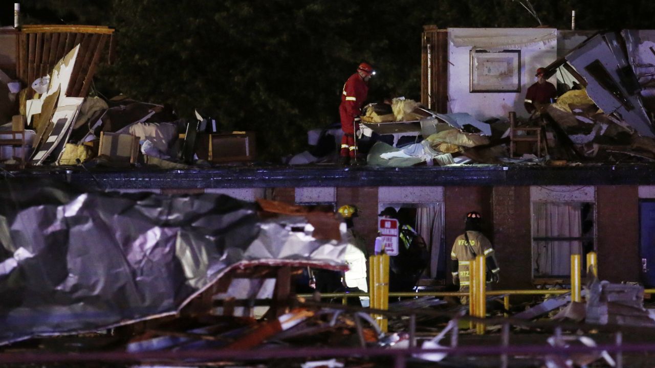 Emergency workers check what is left of the second floor of a hotel in El Reno.