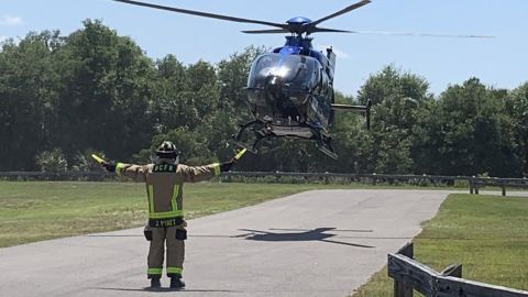 A woman is airlifted to a hospital for treatment after being bitten by an alligator.