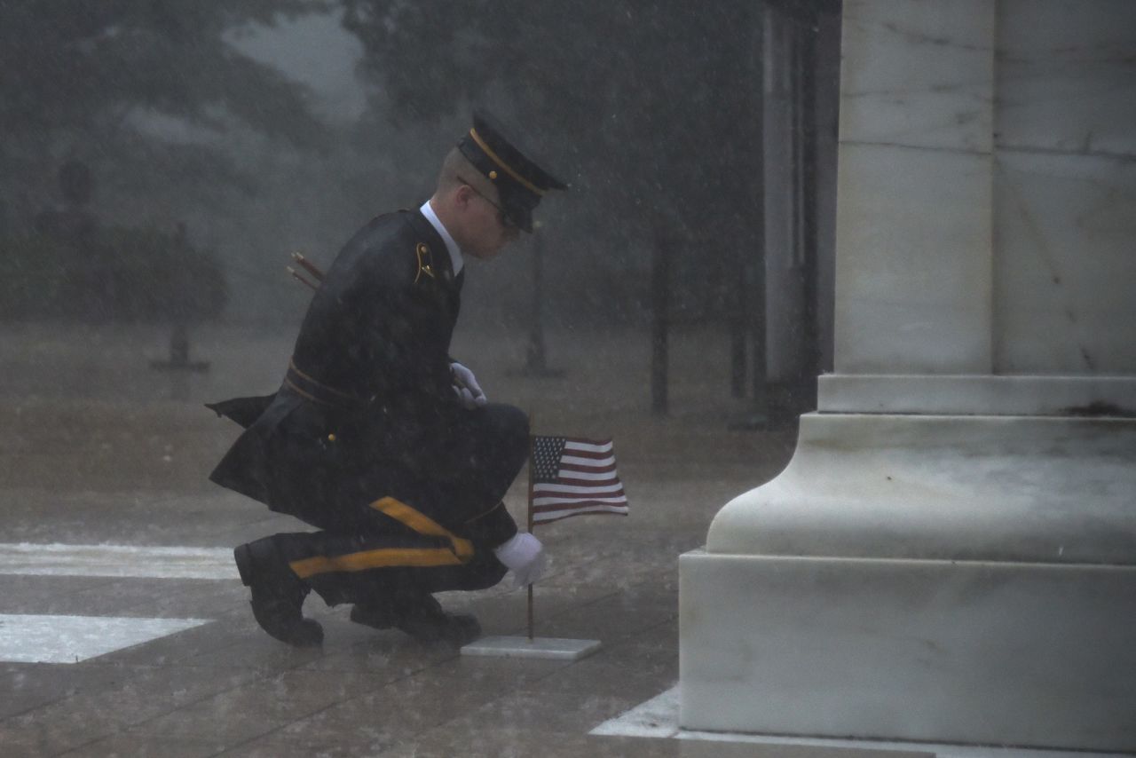 A soldier <a href="https://www.cnn.com/2019/05/25/us/solider-braves-elements-to-honor-fallen-soldiers-trnd/index.html" target="_blank">places a flag at the Tomb of the Unknown Soldier</a> during a severe storm in Arlington, Virginia, on Thursday, May 23. "With only a few watching from cover, a Tomb Sentinel approached the Unknowns with (US) flags in hand," the Army's 3rd Infantry Regiment said <a href="https://www.facebook.com/usarmyoldguard/posts/2464461996911228" target="_blank" target="_blank">in a Facebook post.</a> "As thunder shook the ground and rains washed down without abandon, the Tomb Sentinel pierced through the elements with breath-taking precision." 