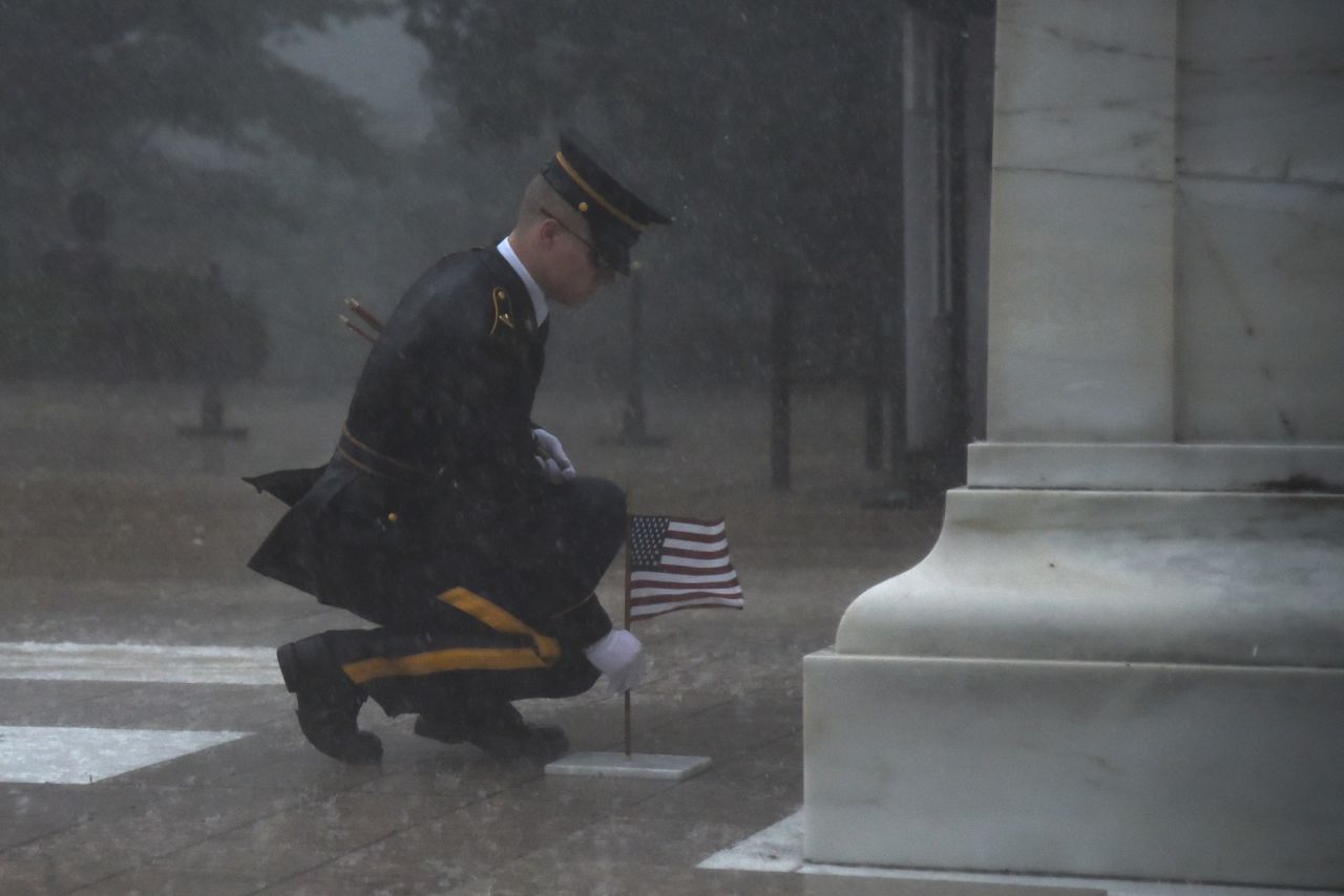 A soldier <a href="https://www.cnn.com/2019/05/25/us/solider-braves-elements-to-honor-fallen-soldiers-trnd/index.html" target="_blank">places a flag at the Tomb of the Unknown Soldier</a> during a severe storm in Arlington, Virginia, on Thursday, May 23. "With only a few watching from cover, a Tomb Sentinel approached the Unknowns with (US) flags in hand," the Army's 3rd Infantry Regiment said <a href="https://www.facebook.com/usarmyoldguard/posts/2464461996911228" target="_blank" target="_blank">in a Facebook post.</a> "As thunder shook the ground and rains washed down without abandon, the Tomb Sentinel pierced through the elements with breath-taking precision."