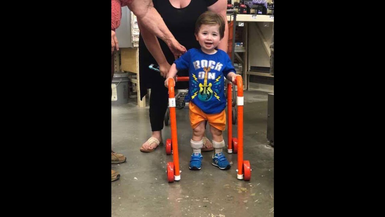 Logan looks happy with his new walker.