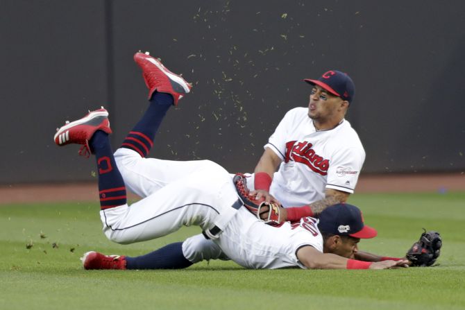 Leonys Martin, top, of the Cleveland Indians and Oscar Mercado collide while going after a ball hit by Kevin Kiermaier of the Tampa Bay Rays during the sixth inning of a baseball game on Thursday, May 23 in Cleveland, Ohio. Kiermaier scored a rare inside-the-park home run. 