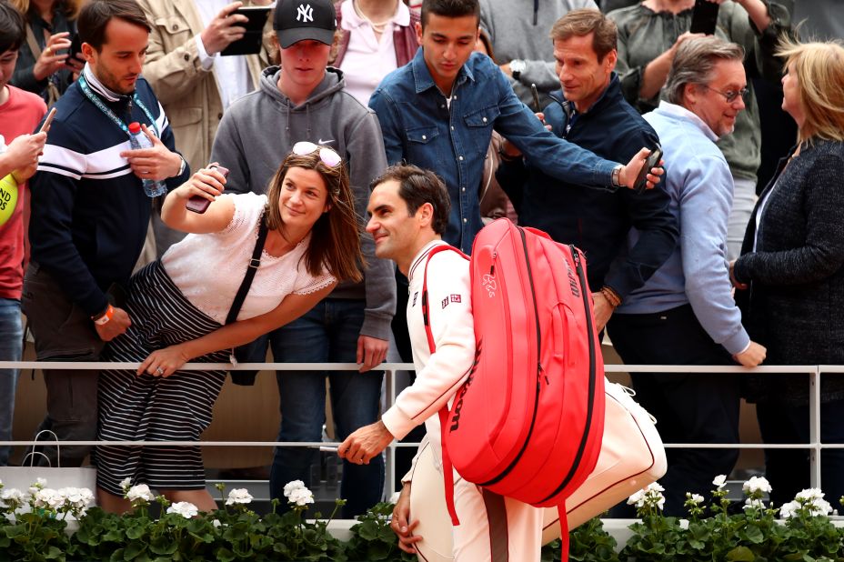 Federer signed autographs and posed for a selfie or two after the win. 