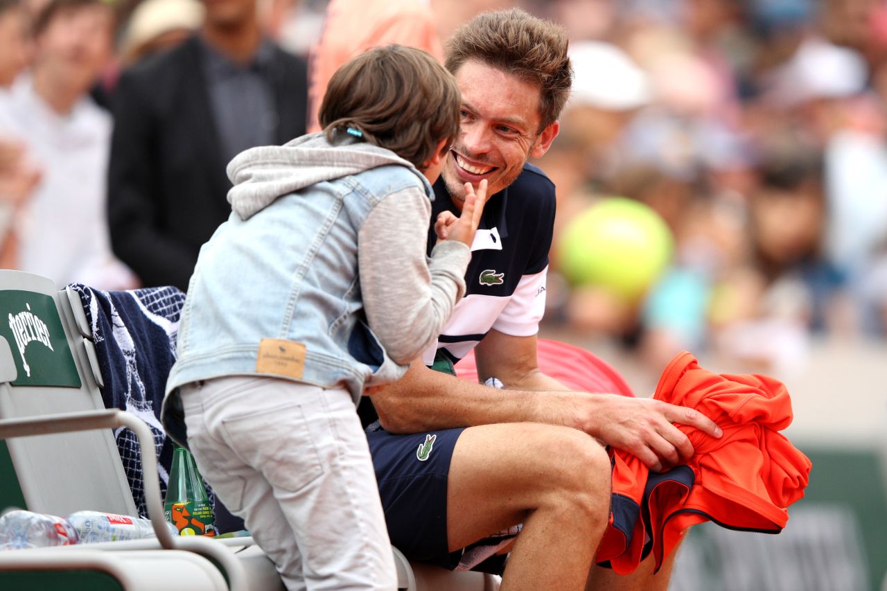 The French wildcard upset 2018 semifinalist Marco Cecchinato from two sets down, then celebrated with his son on court. 