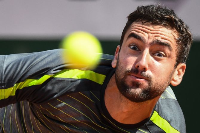 Croatia's Marin Cilic eyes the ball before returning it to Italy's Thomas Fabbiano during their men's singles first round match on Day 1 of the Roland Garros 2019 French Open tennis tournament in Paris on Sunday, May 26. 