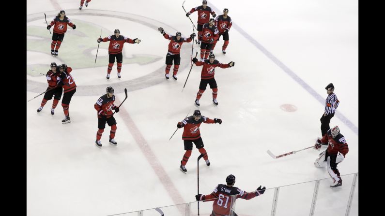 Canada's Mark Stone, foreground, celebrates after scoring the game-winning goal in overtime to give Canada a 3-2 victory during the Ice Hockey World Championships quarterfinal match between Canada and Switzerland in Kosice, Slovakia on Thursday, May 23.