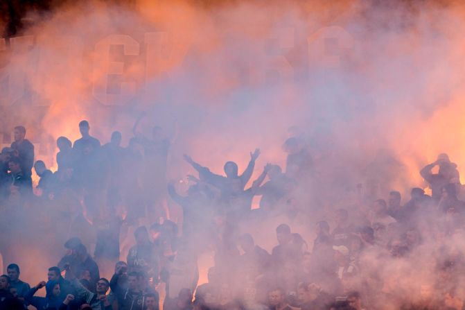 Partizan Belgrade's fans light flares and smoke bombs as they cheer their team on during their Serbian Cup Finals soccer fixture against Red Star Belgrade in Belgrade, Serbia, on Thursday, May 23.