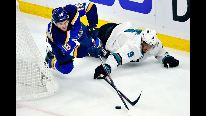 St. Louis Blues center Robert Thomas and San Jose Sharks left wing Evander Kane battle for the puck behind the net during the first period in Game 6 of the Western Conference Final of the 2019 Stanley Cup Playoffs at Enterprise Center in St. Louis, Missouri on Tuesday, May 21.