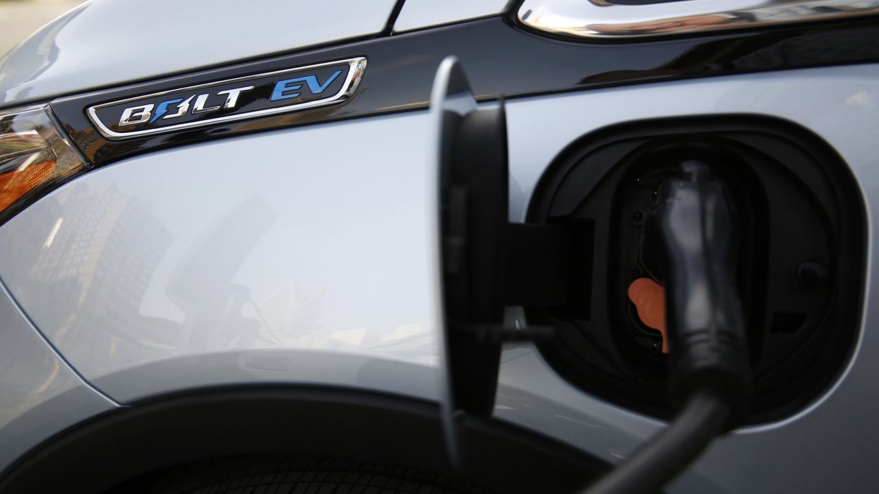 A General Motors Co. (GM) Chevrolet Bolt electric vehicle (EV) charges outside of the company's Renaissance Center world headquarters complex in Detroit, Michigan, U.S., on Tuesday, June 12, 2018. The automaker still has a?financial investment?in Lyft Inc. but has no active projects underway with the ride-hailing platform, said GM chairman and chief executive Mary Barra before the company's annual shareholders meeting. Photographer: Jeff Kowalsky/Bloomberg via Getty Images