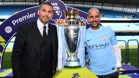 Manchester City chairman Khaldoon Al Mubarak (left) poses with Pep Guardiola after winning EPL title.