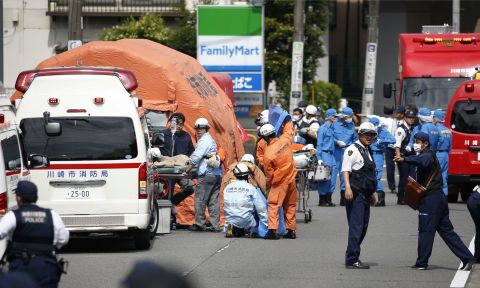 Rescue workers at the scene of an attack in Kawasaki, near Tokyo on Tuesday, May 28.