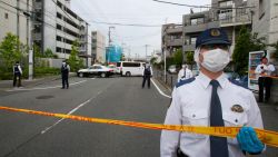 Police officers guard at the scene where a man wielding a knife attacked commuters in Kawasaki, near Tokyo Tuesday, May 28, 2019. A man carrying a knife in each hand and screaming "I will kill you" attacked a group of schoolchildren waiting at a bus stop just outside Tokyo on Tuesday. (AP Photo/Koji Sasahara)