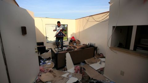 Carl Shackleford Jr. surveys storm damage Tuesday at his apartment in Trotwood, Ohio. 