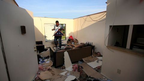 Carl Shackleford Jr. surveys storm damage Tuesday at his apartment in Trotwood, Ohio.
