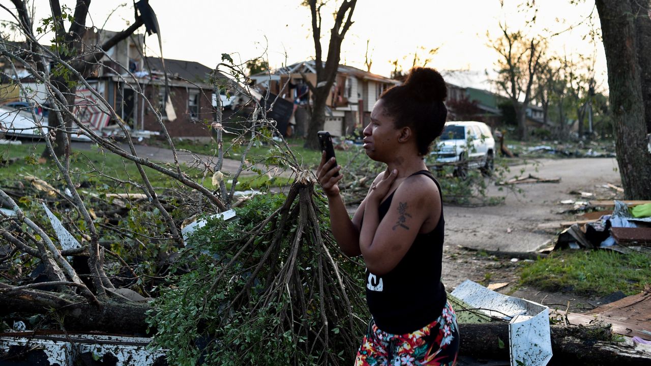 A resident inspects damage following powerful tornadoes in Trotwood, Ohio. 