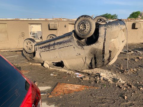 Mud covers a flipped car in Celina, Ohio, on May 28.