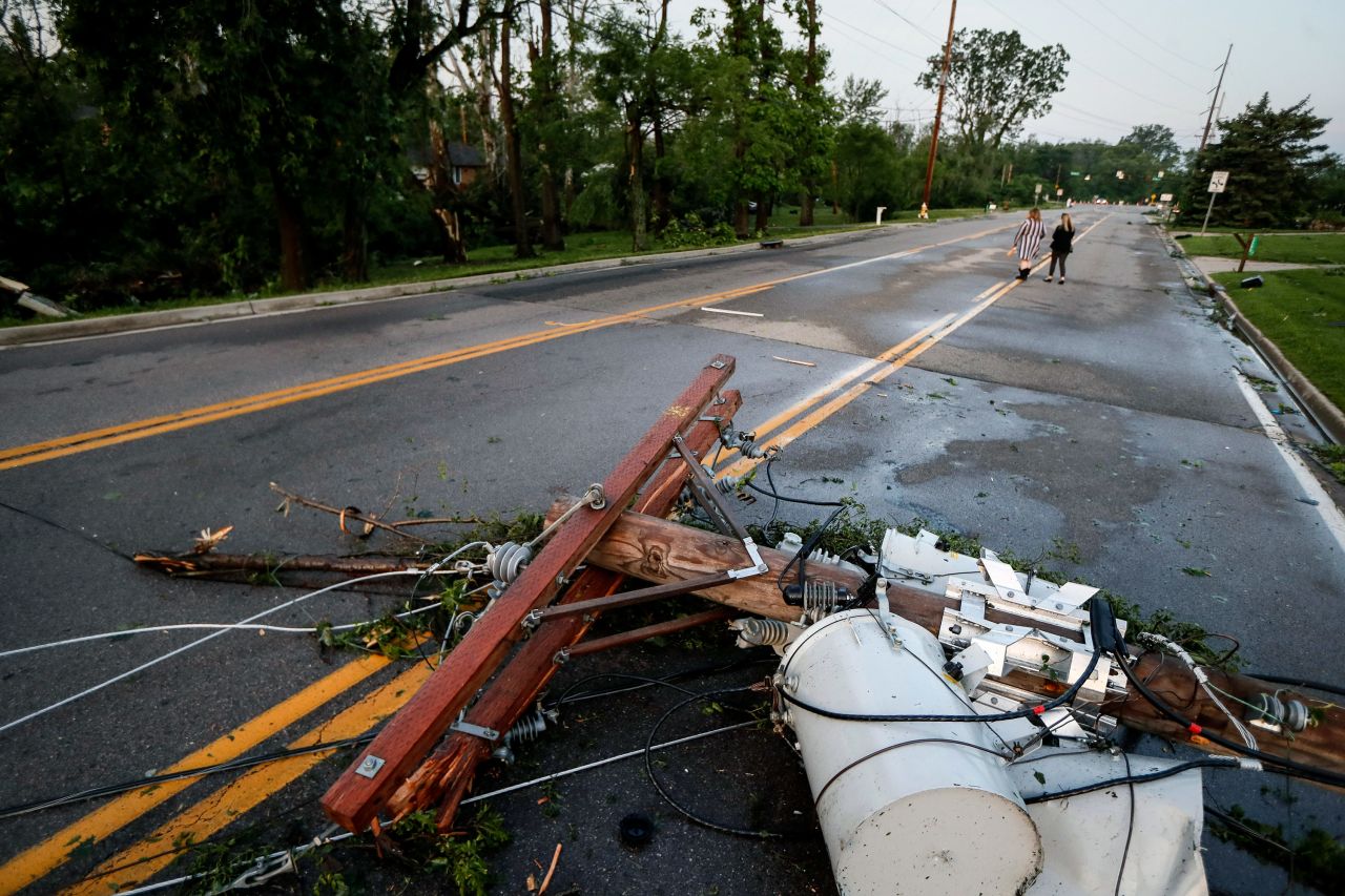 A utility pole lies in a street in Vandalia, Ohio. More than 70,000 utility customers were without power in Ohio, the weather service in Wilmington said early May 28, citing data from the US Department of Energy.