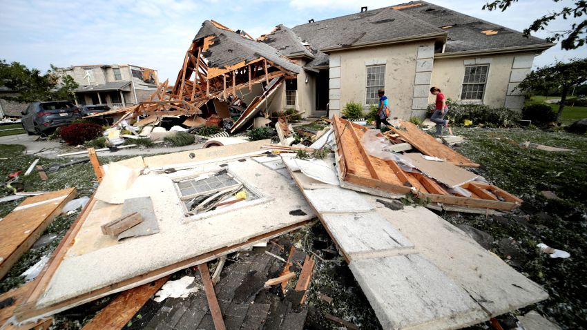 Neighbors in Clayton, Ohio gather belongings after houses were damaged after a tornado touched down overnight near Dayton, Ohio, U.S. May 28, 2019. REUTERS/Kyle Grillot