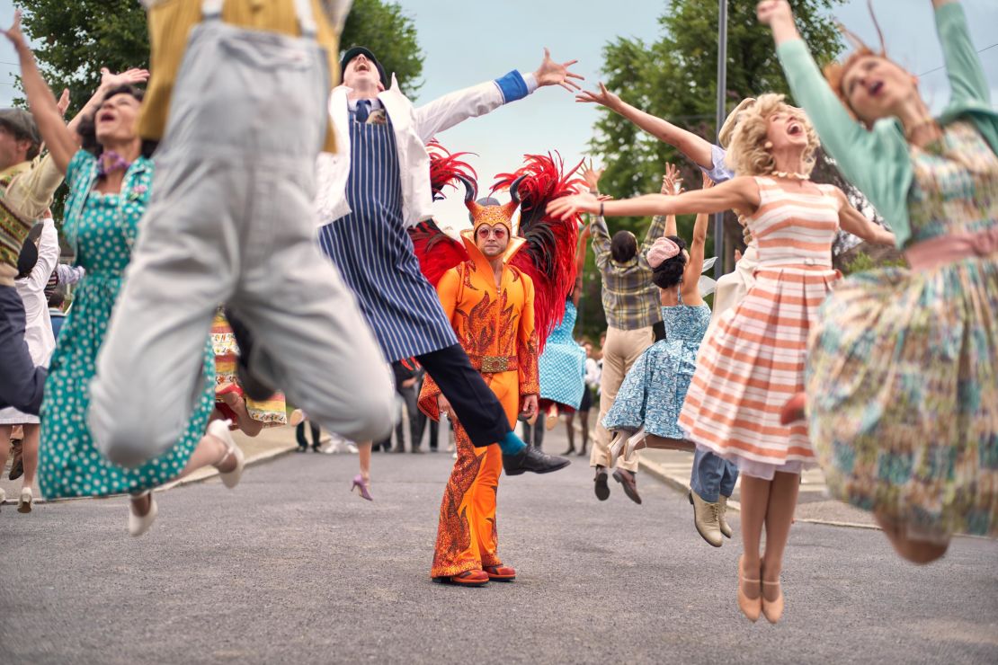 Actor Taron Egerton playing Elton John in Day's "devil" suit.