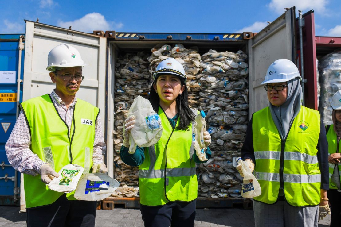 Malaysian Minister of Energy, Science, Technology, Environment and Climate Change Yeo Bee Yin shows samples of plastics waste shipment from Australia on May 28, 2019. 