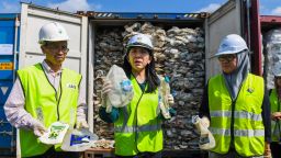 Malaysian Minister of Energy, Science, Technology, Environment and Climate Change Yeo Bee Yin shows samples of plastics waste shipment from Australia on May 28, 2019. 