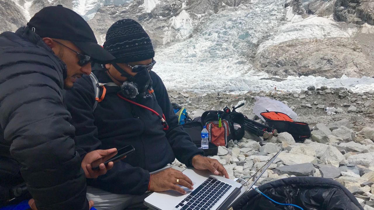 CNN cameraman Rajesh Mishra is seen wearing oxygen mask.