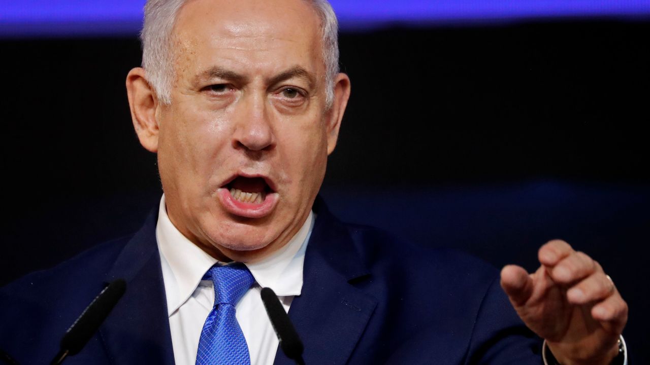 Israeli Prime Minister Benjamin Netanyahu gestures as he addresses supporters on election night at his Likud Party headquarters in the Israeli coastal city of Tel Aviv early on April 10, 2019. - The results from yesterday's vote came despite corruption allegations against the 69-year-old premier and put him on track to become Israel's longest-serving prime minister later this year. (Photo by THOMAS COEX / AFP)        (Photo credit should read THOMAS COEX/AFP/Getty Images)