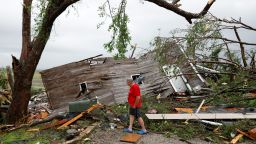 Joe Armison looks over his destroyed barn after a tornado struck the outskirts of Eudora, Kan., Tuesday, May 28, 2019. (AP Photo/Colin E. Braley)