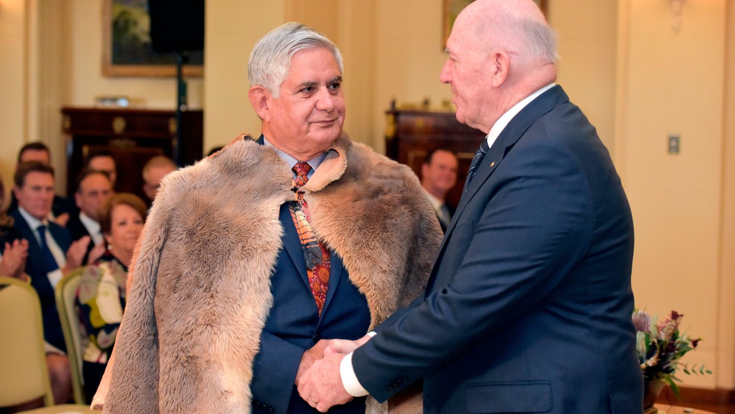 Governor General Peter Cosgrove (right) congratulates Minister for Indigenous Australians Ken Wyatt during an oath-taking ceremony at Government House in Canberra on May 29, 2019. 