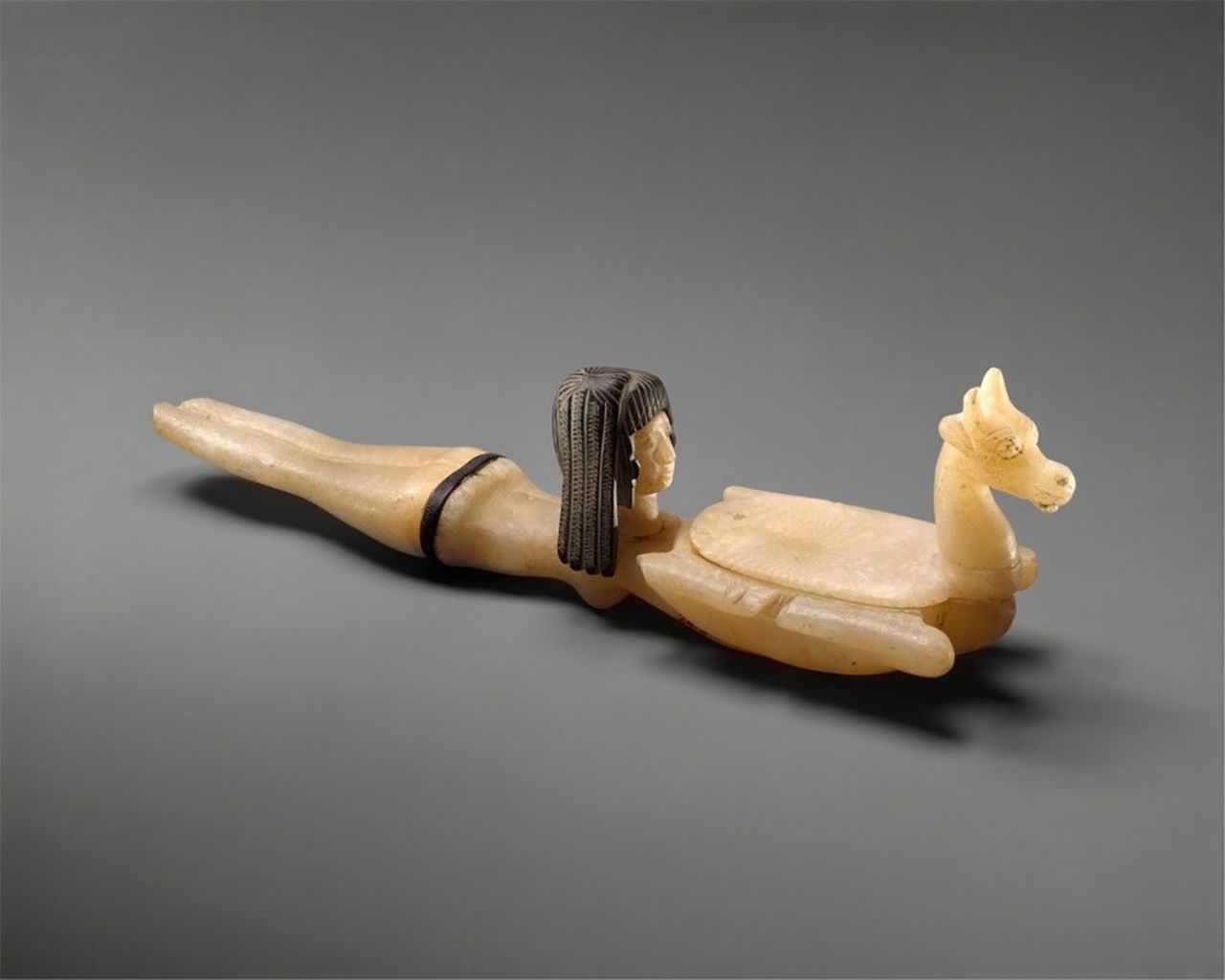 Cosmetic Spoon in the Shape of Swimming Woman Holding a Dish, ca. 1390-1352 B.C.