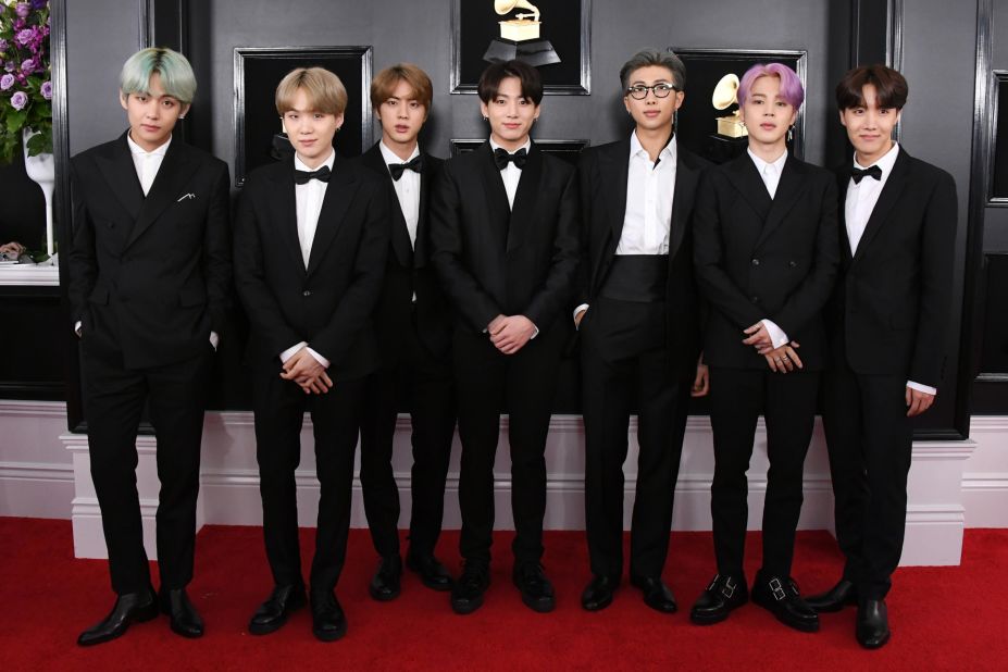 BTS attend the Grammy Awards where they become the first K-pop group to present an award on February 10, 2019, in Los Angeles. 