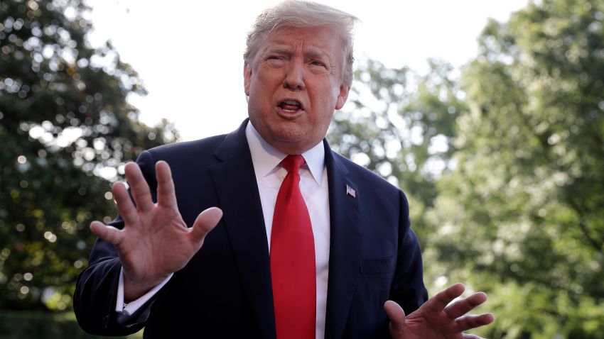 President Donald Trump talks with reporters before departing on Marine One for the Air Force Academy graduation ceremony, Thursday, May 30, 2019, in Washington. (AP Photo/Evan Vucci)
