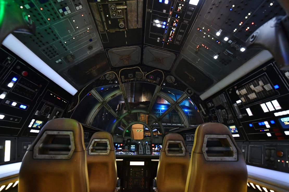 Inside the Millennium Falcon cockpit where guests pilot the "fastest hunk of junk in the galaxy" on a dangerous cargo run.