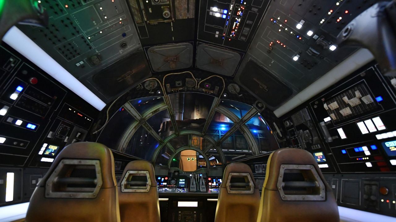 Inside the Millennium Falcon cockpit where guests pilot the "fastest hunk of junk in the galaxy" on a dangerous cargo run.