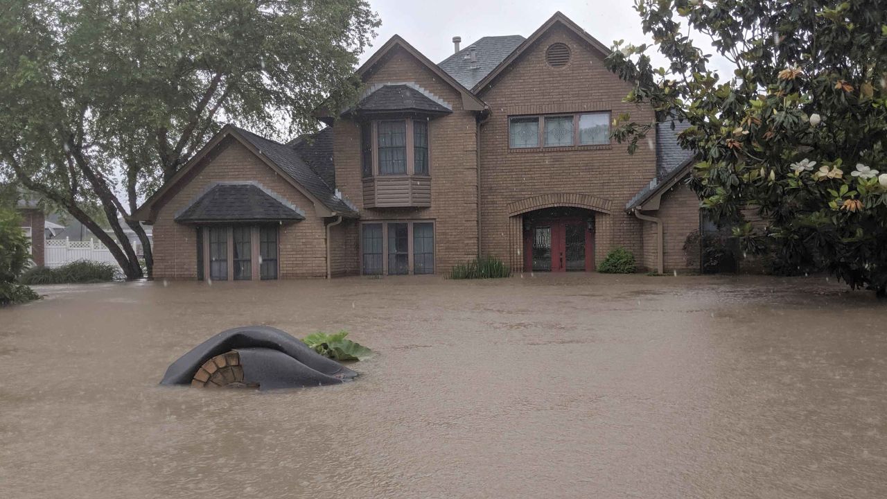 Floodwaters surround a home Wednesday in Fort Smith. 