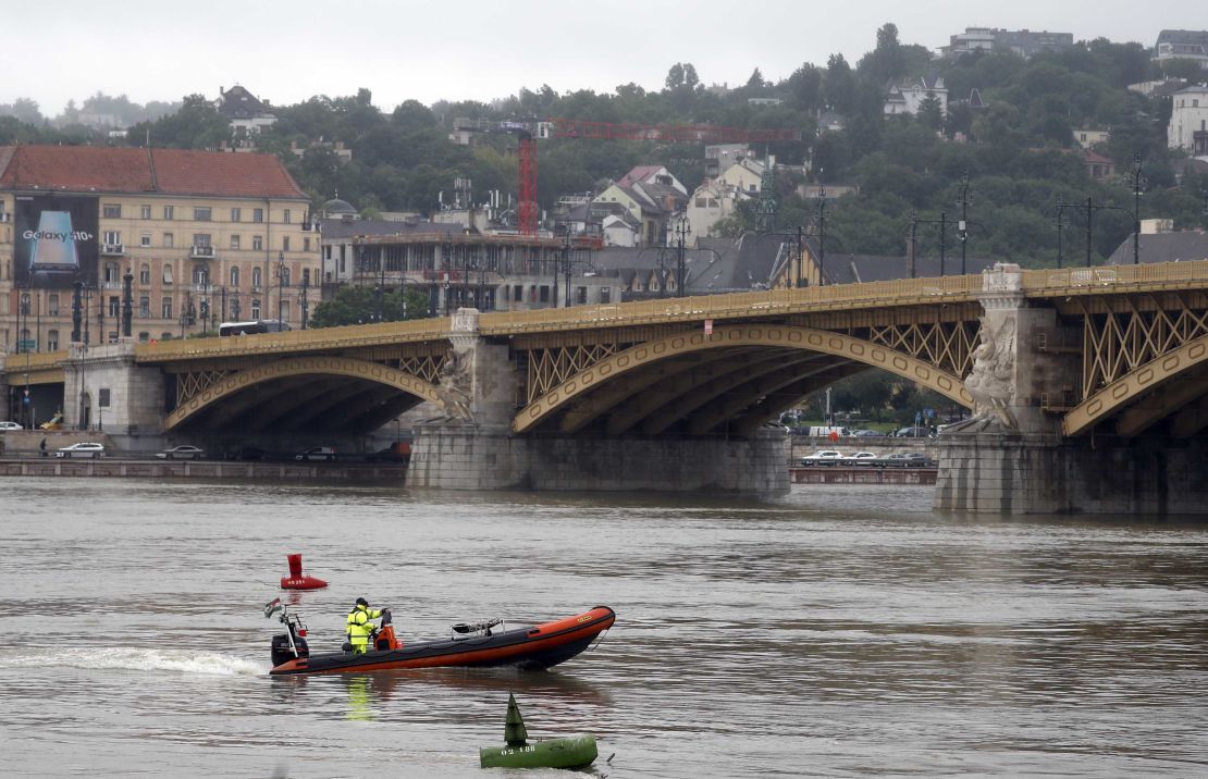 A rescue boat searches for survivors on the River Danube in Budapest, Hungary.