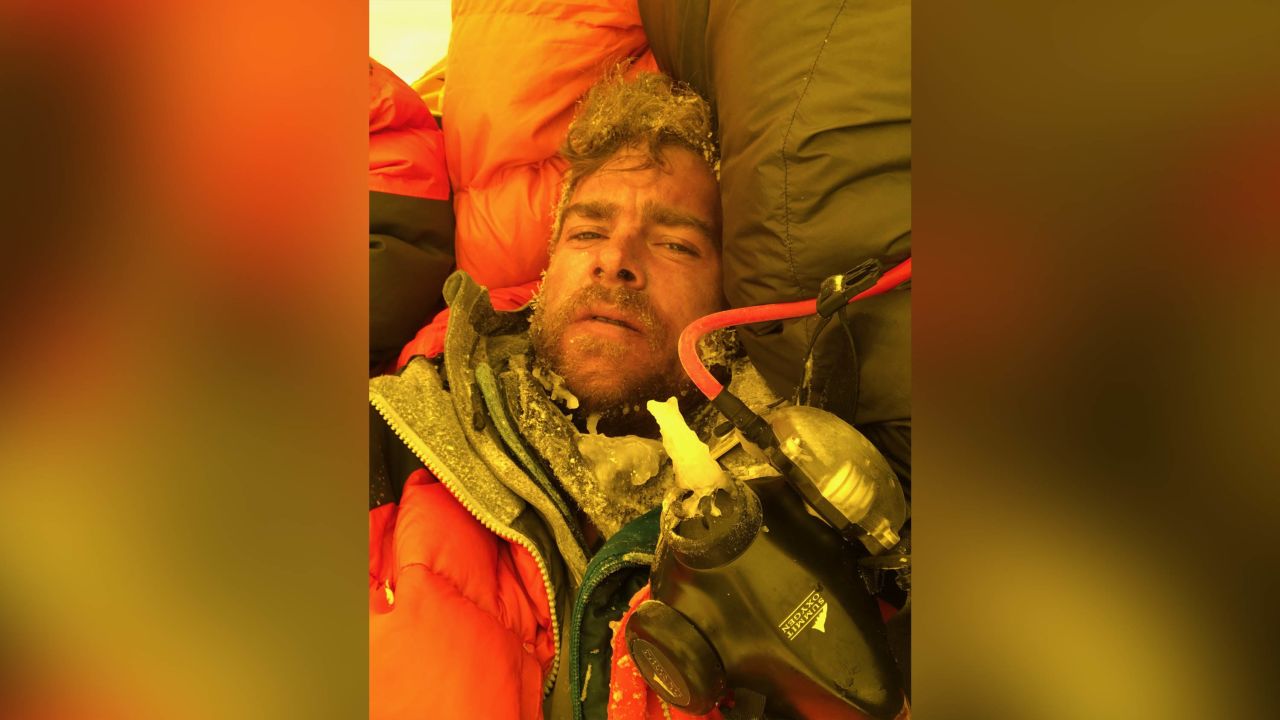 Ian Stewart covered in icicles and snow collapses in his tent after summiting Everest.
