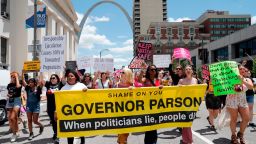 Abortion-rights supporters march Thursday, May 30, 2019, in St. Louis. A St. Louis judge heard an hour of arguments Thursday on Planned Parenthood's request for a temporary restraining order that would prohibit the state from allowing the license for Missouri's only abortion clinic to lapse at midnight Friday. (AP Photo/Jeff Roberson)