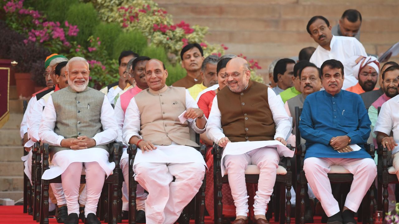 Narendra Modi (left) looks on next to BJP President Amit Shah (second from right) and Modi's first-term Home Affairs Minister Rajnath Singh (second from left) before his swearing-in as Indian Prime Minister on May 30.