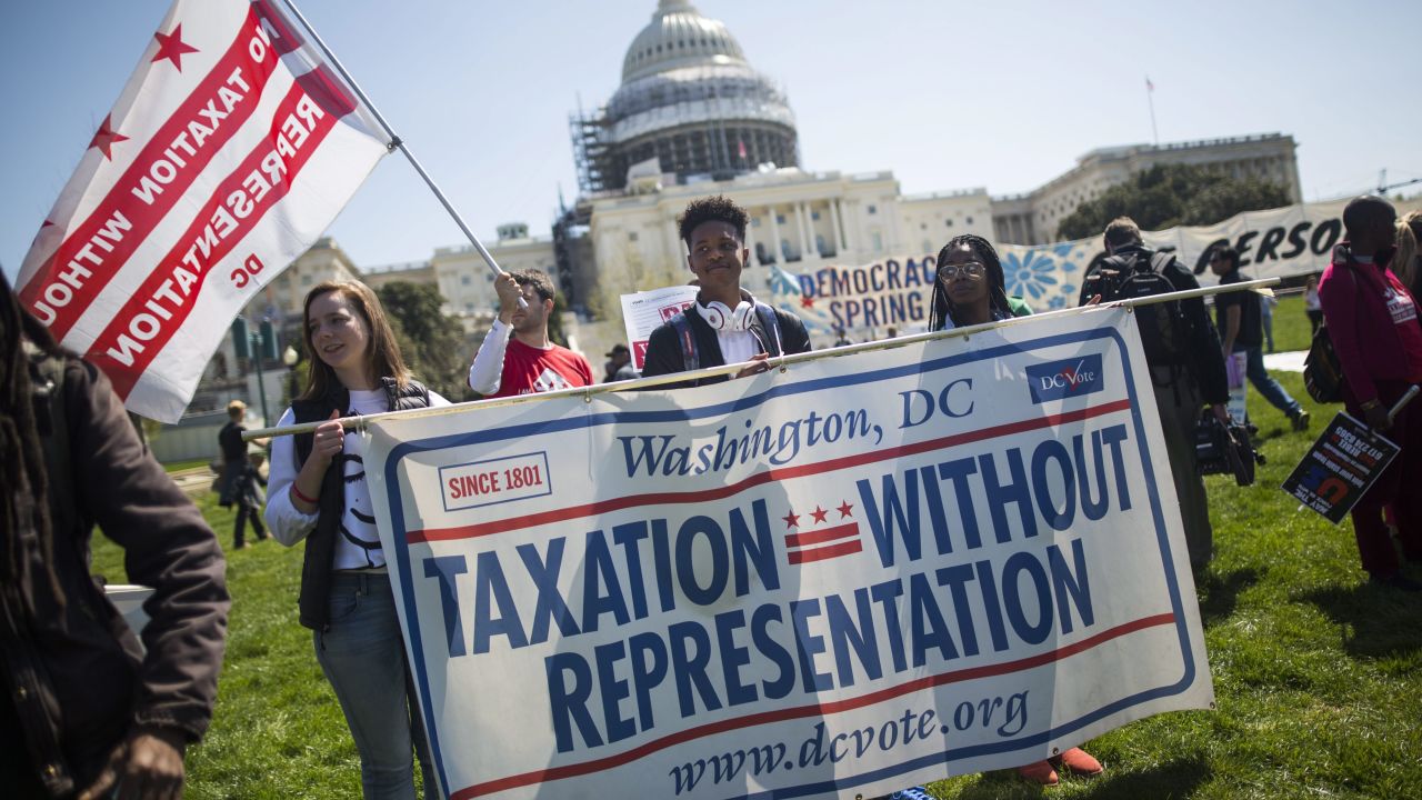 Supporters of DC statehood call for an end to 'Taxation Without Representation' as they protest outside the US Capitol in Washington in April 2016.