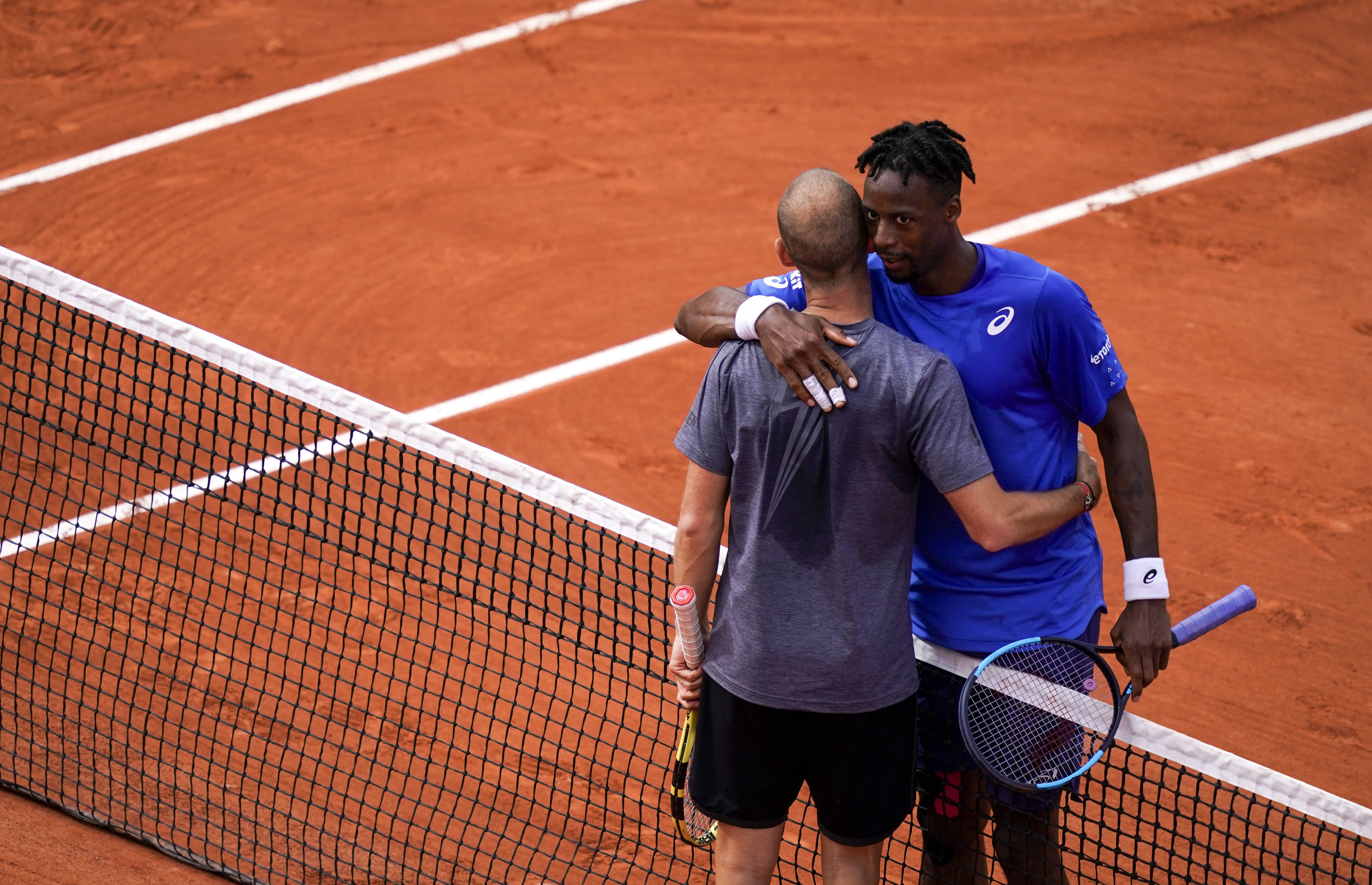 Will Gael Monfils (blue shirt) be the first Frenchman to win Roland Garros since Yannick Noah in 1983? He is still in contention after beating his ailing compatriot, Adrian Mannarino.
