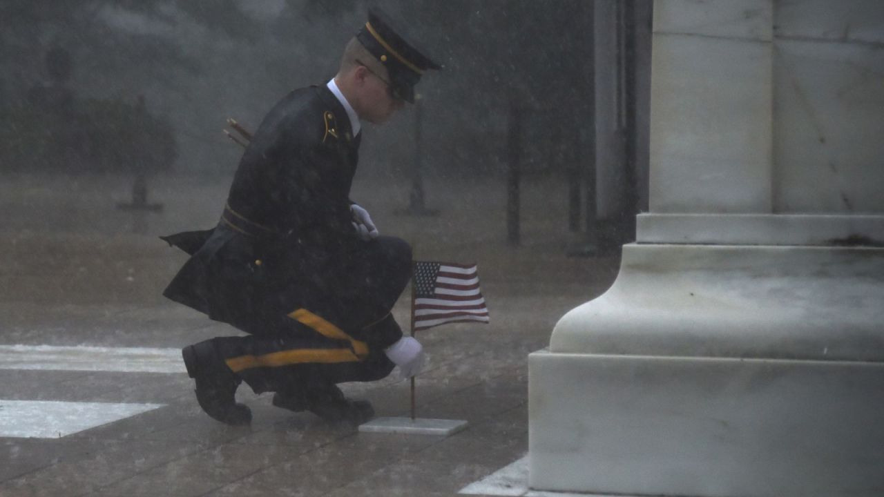 A member of the 3rd US Infantry Regiment <a href="https://www.cnn.com/2019/05/25/us/solider-braves-elements-to-honor-fallen-soldiers-trnd/index.html" target="_blank">places a flag at the Tomb of the Unknown Soldier</a> during a severe storm in Arlington, Virginia, on Thursday, May 23. 