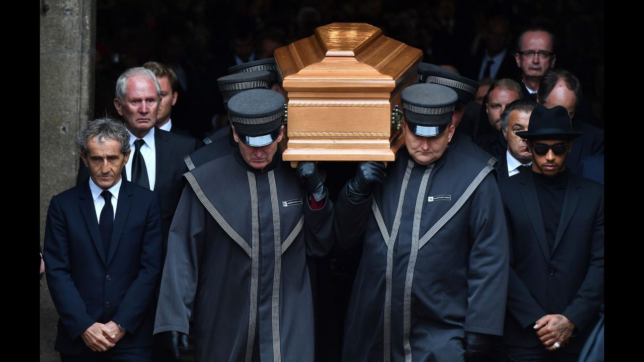 Formula One champion Lewis Hamilton, right, and former champion Alain Prost, left, walk next to the coffin of <a href="http://www.cnn.com/2019/05/21/motorsport/gallery/niki-lauda-gallery/index.html" target="_blank">Niki Lauda</a> as it's carried out of a cathedral in Vienna, Austria, on Wednesday, May 29. Lauda, who recovered from a near-fatal accident to become one of racing's greatest drivers, <a href="https://www.cnn.com/2019/05/21/sport/niki-lauda-death-intl/index.html" target="_blank">died Monday</a> at the age of 70.