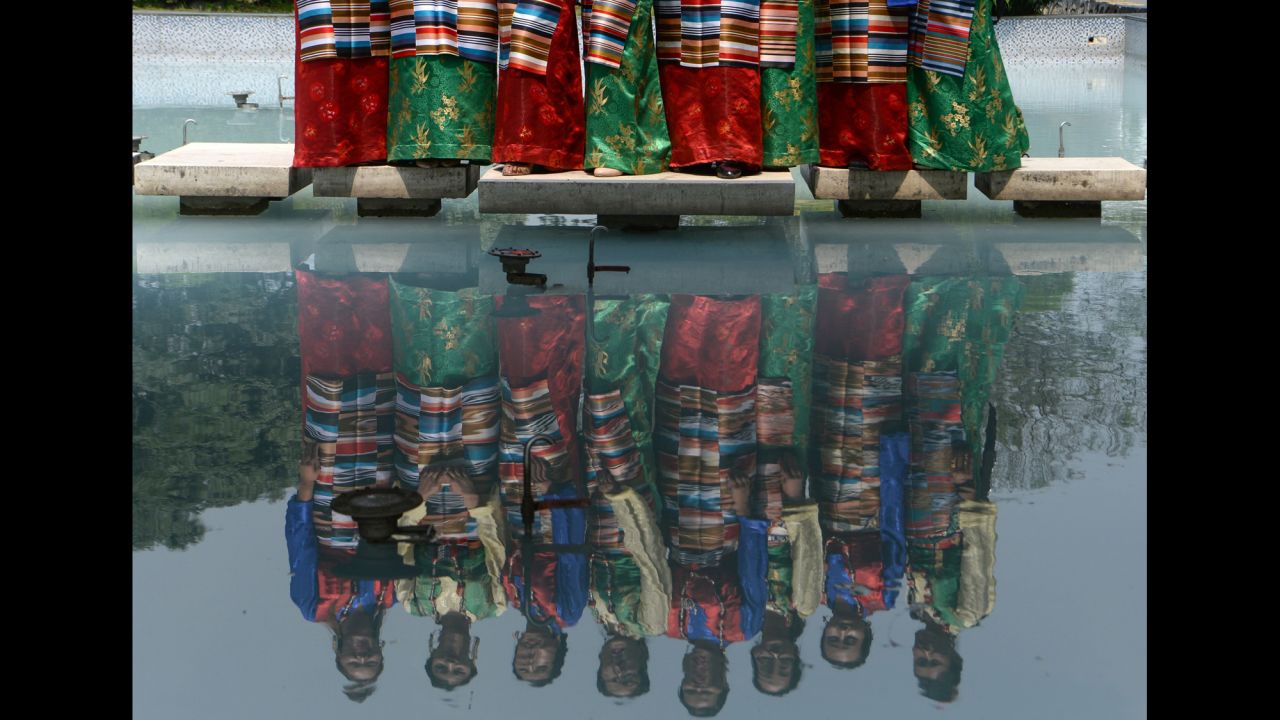 Sherpa women dressed in traditional attire pose for pictures Wednesday, May 29, during the 12th International Everest Day in Kathmandu, Nepal.