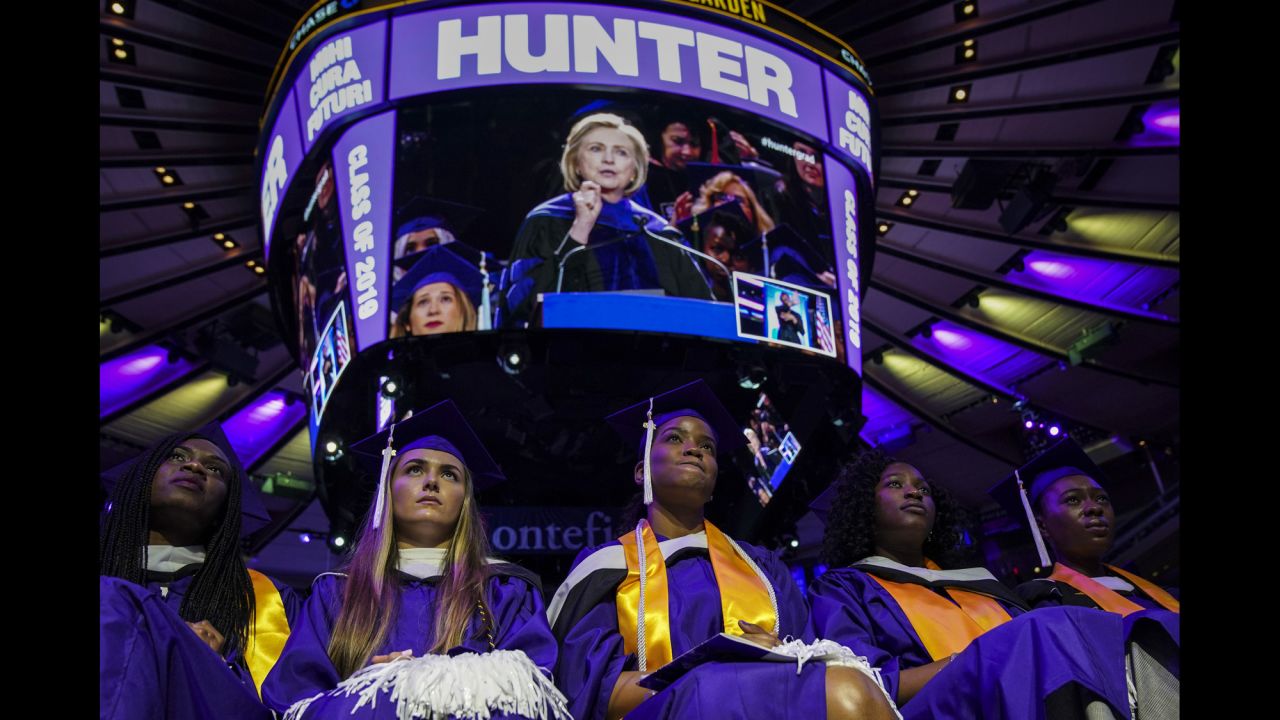 Hunter College graduates listen to former Secretary of State Hillary Clinton, who was delivering their commencement address in New York on Wednesday, May 29.